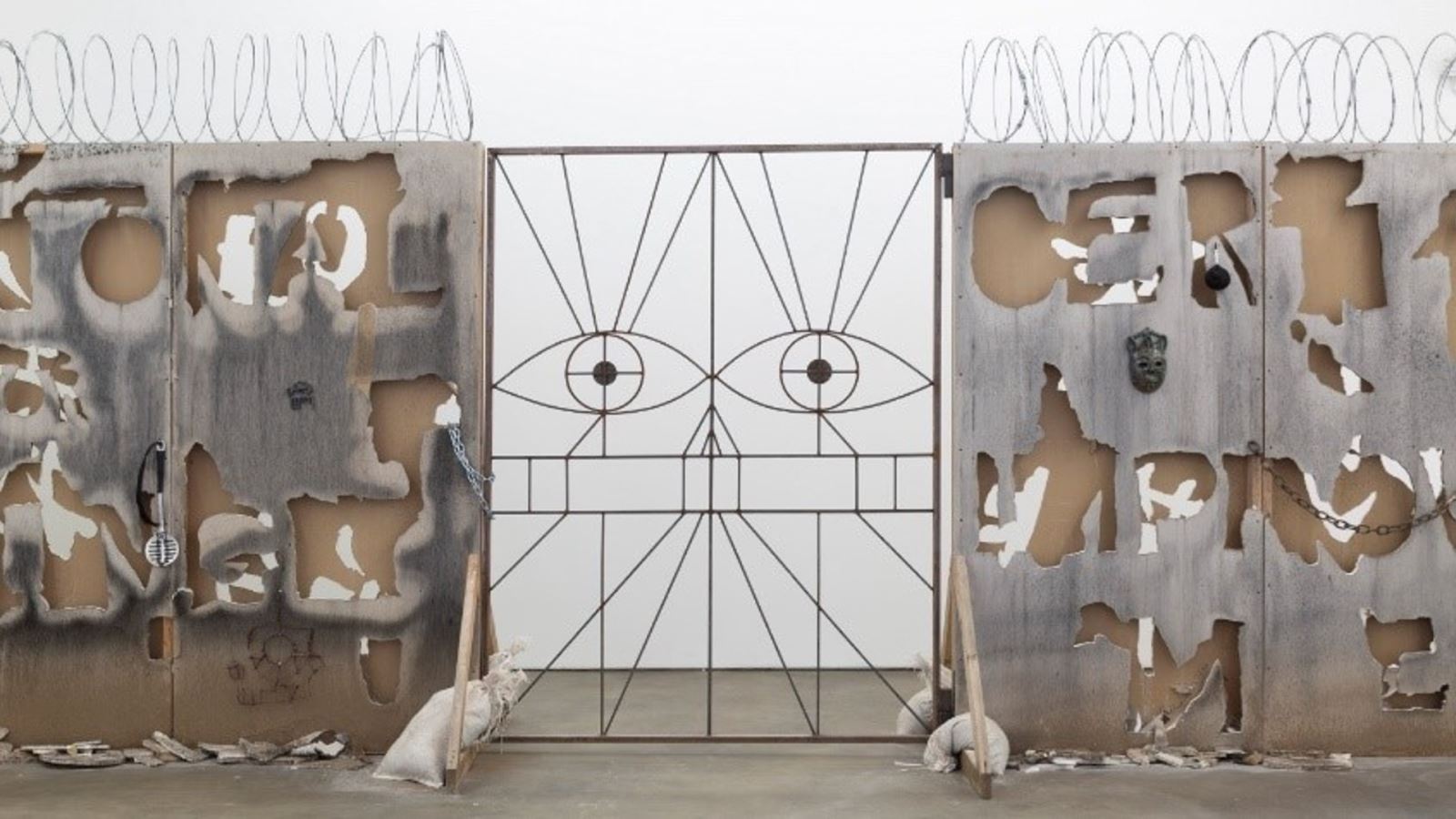 Candice Lin, A Robot Spoke What My Father Wrote (2019), Cut sheetrock, razor wire, bone black pigment and mould, ceramic, welded gate, miscellaneous drawings and printed material. Courtesy the artist and François Ghebaly, Los Angeles